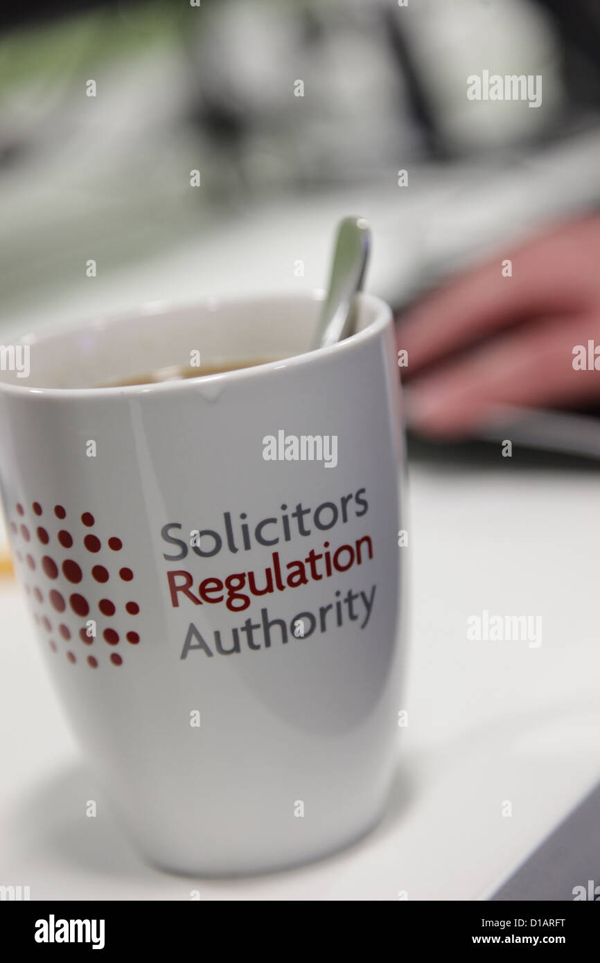 The offices of the Solicitors Regulation Authority in Birmingham. A mug depicts the name of the organization. Stock Photo
