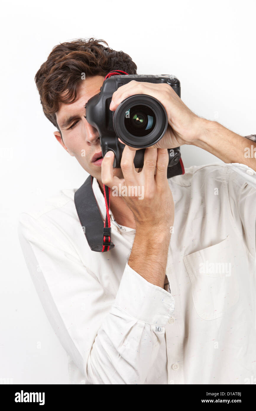 Young man taking photograph vintage camera Stock Photo