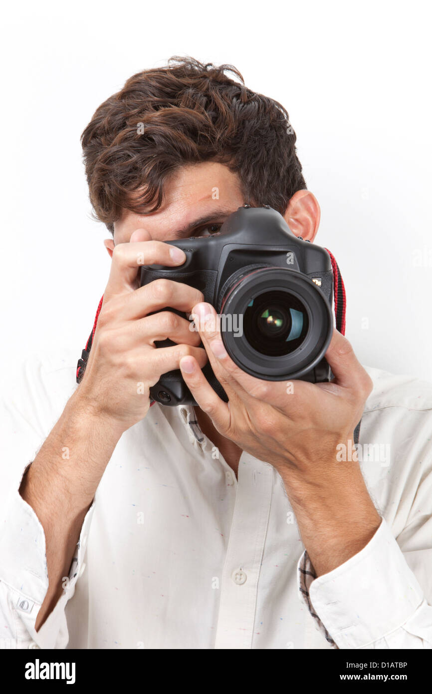 Young man taking photograph vintage camera Stock Photo