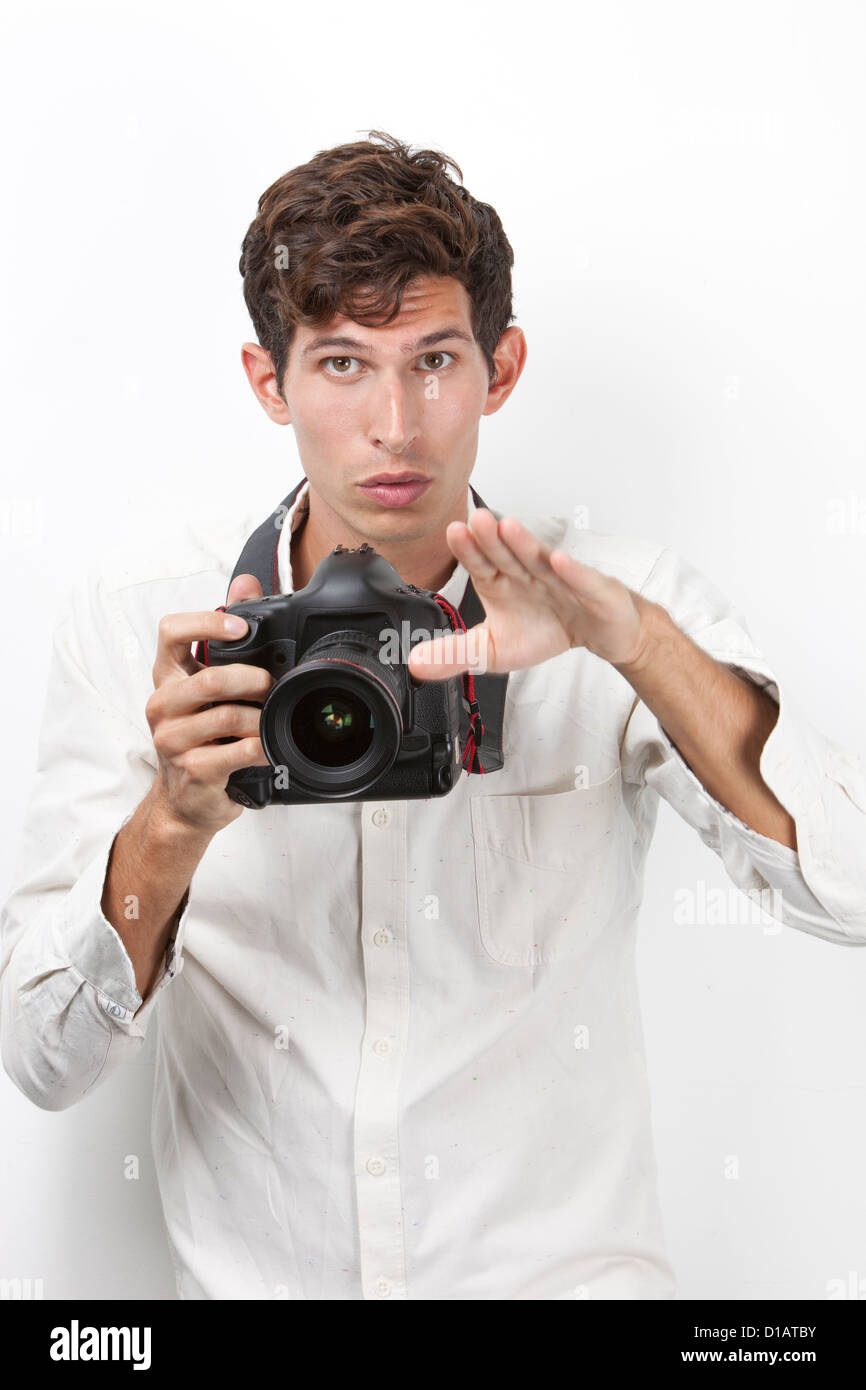 Portrait young photographer vintage camera gesturing Stock Photo