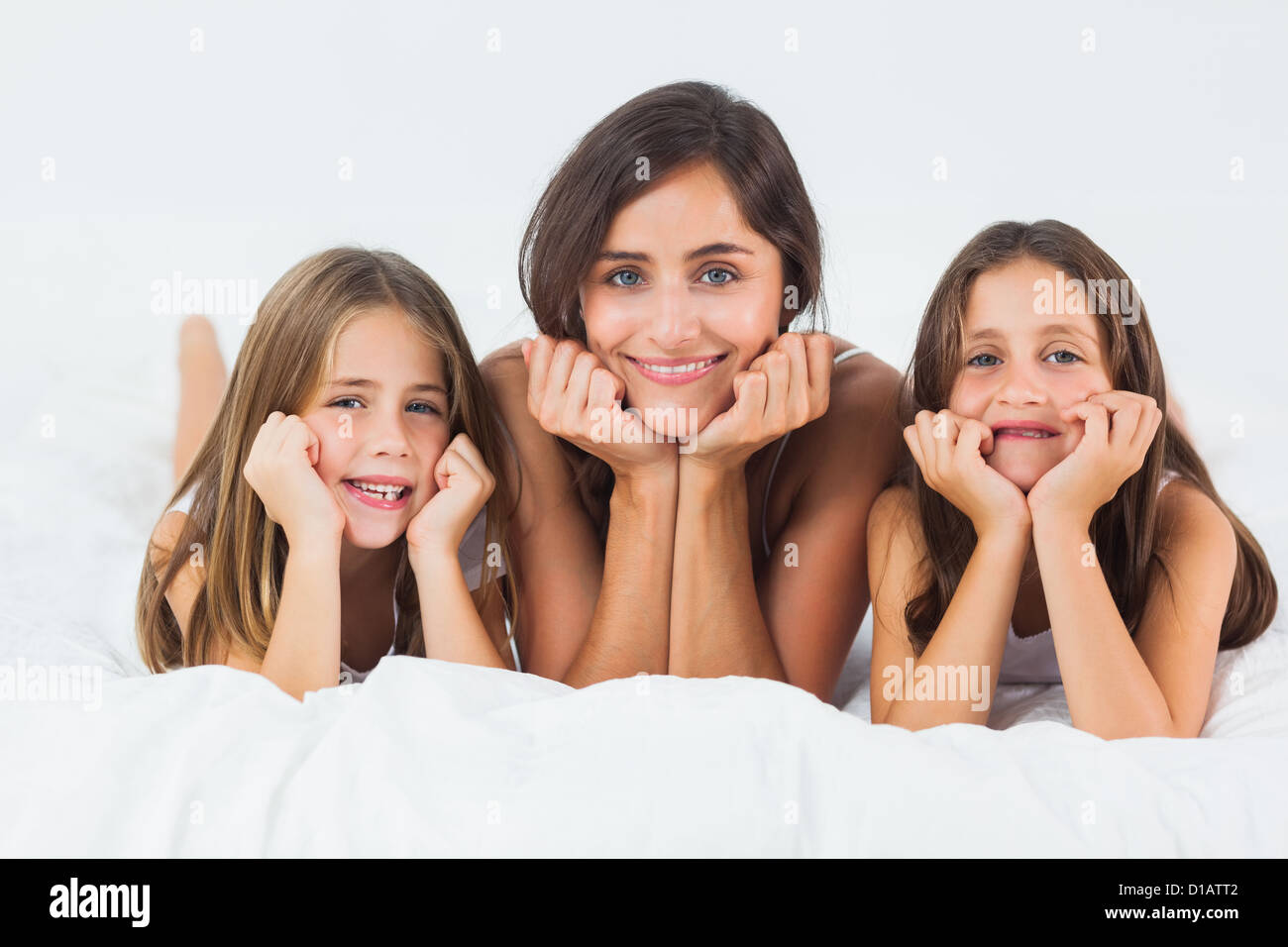 Mother and her children looking at camera Stock Photo - Alamy