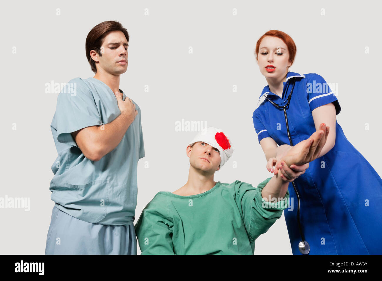Male doctor female nurse treating an injured patient Stock Photo Alamy