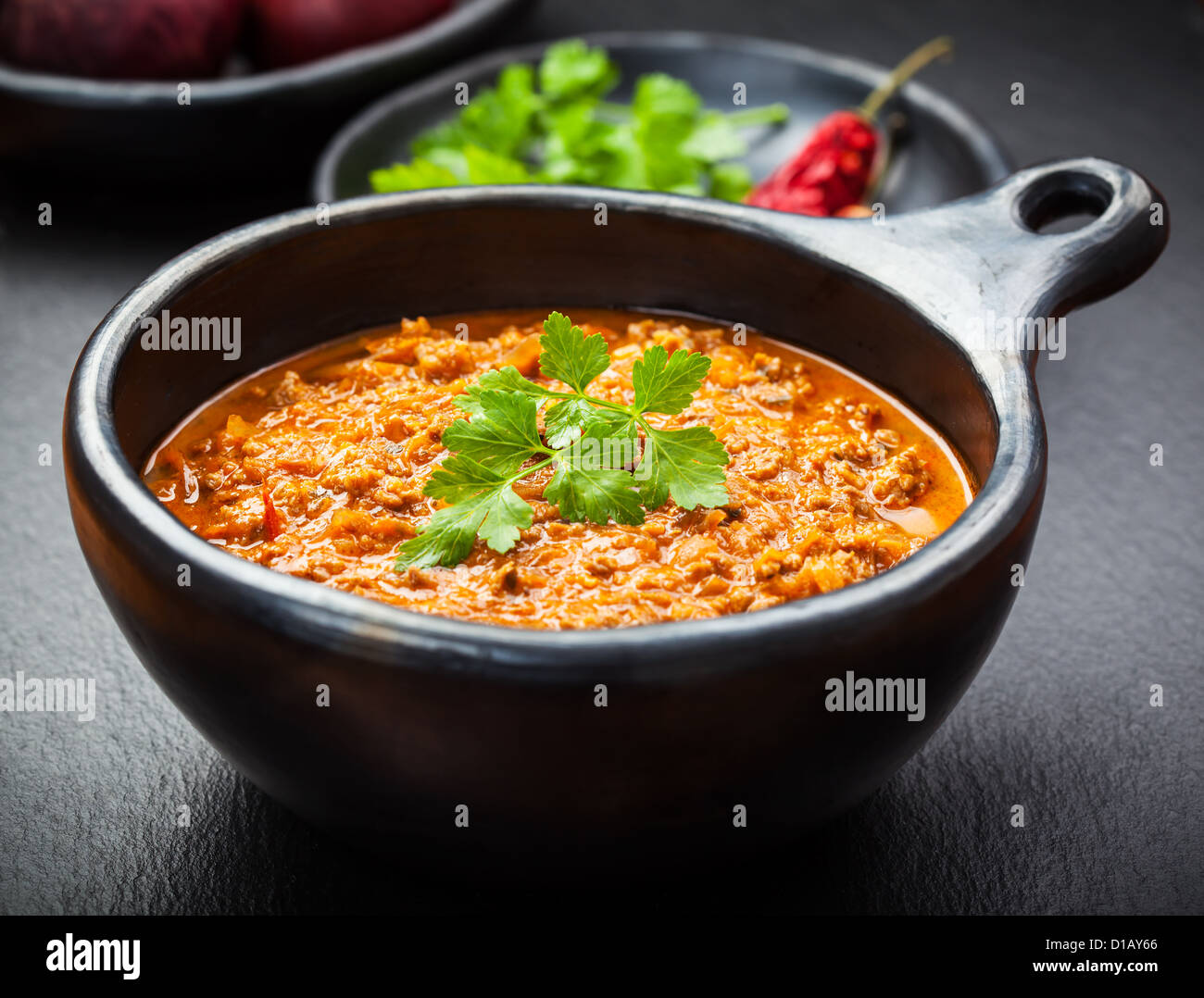 Hot chili con carne cooked in the pan Stock Photo