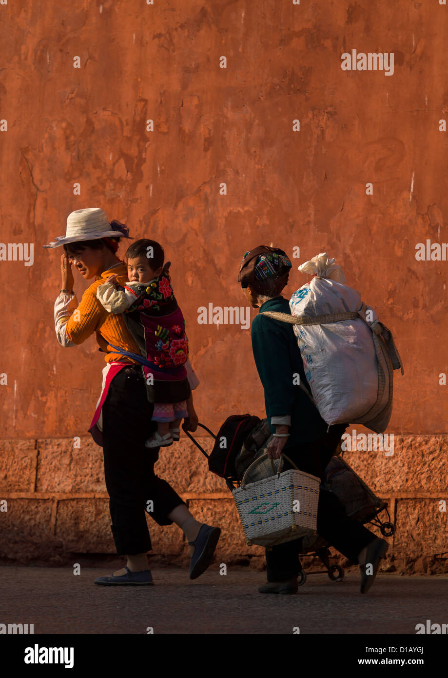 People Passing In Front Of Chaoyang Tower City Gate, Ancient Town, Jianshui, Yunnan Province, China Stock Photo