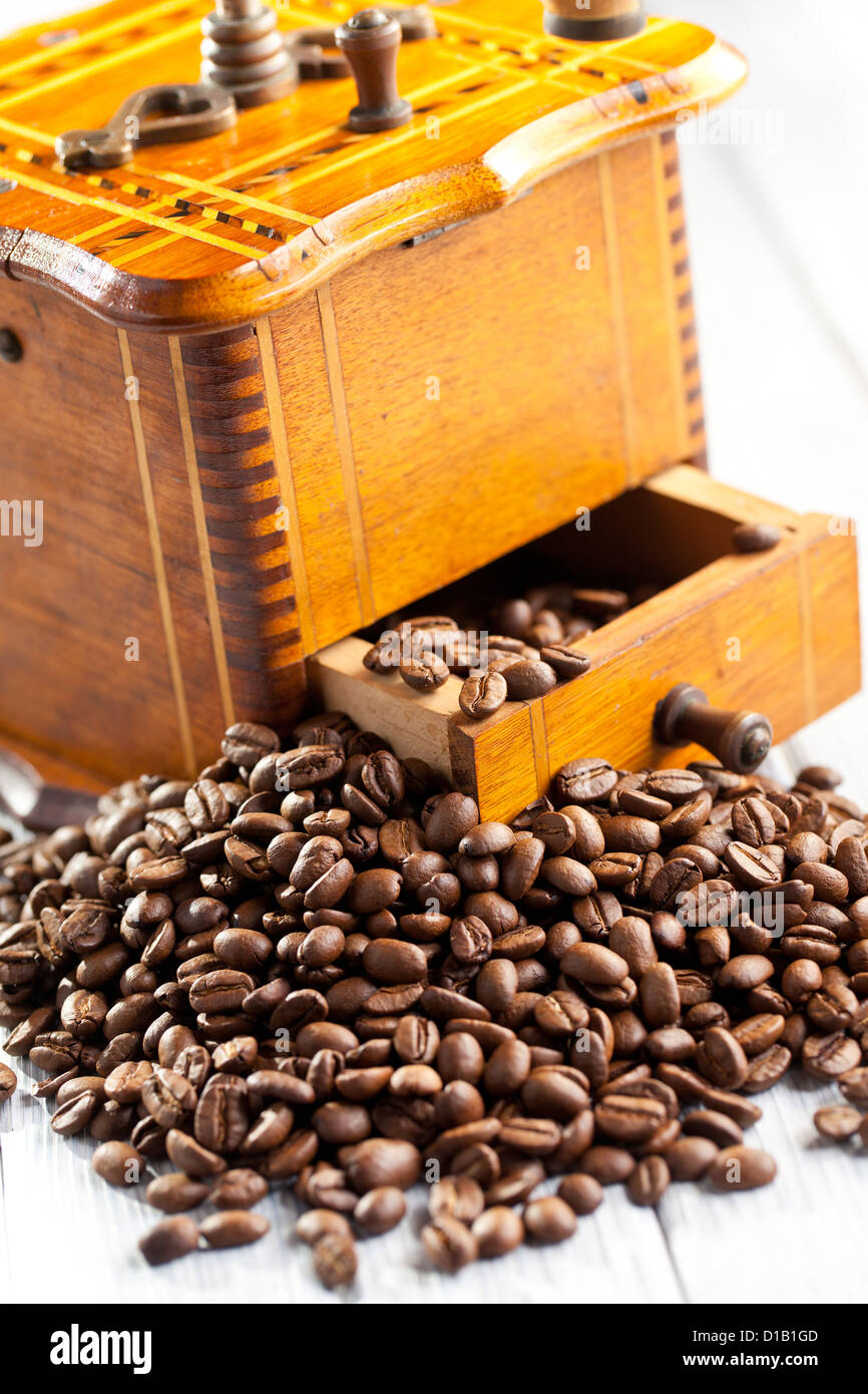 antique coffee mill with coffee beans Stock Photo Alamy
