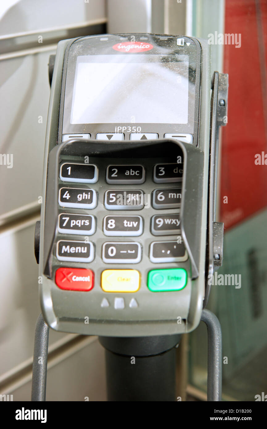 Machine terminal for transaction in Post Office for collecting pension or state benefits Stock Photo