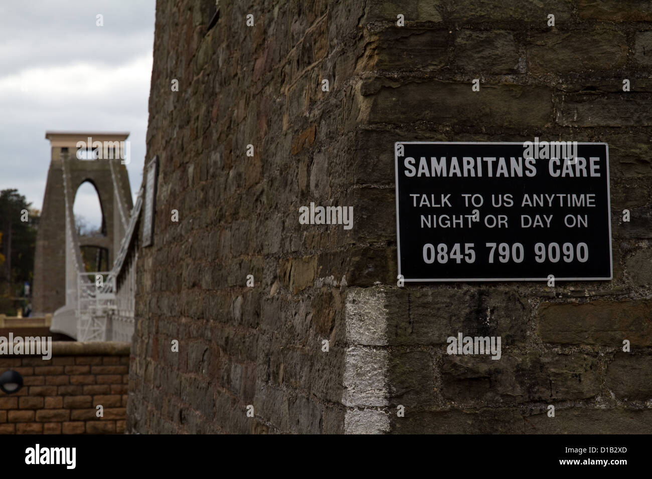 Clifton Suspension Bridge, Bristol, which has a Samaritans sign at the end, in the hope of preventing people from jumping off Stock Photo