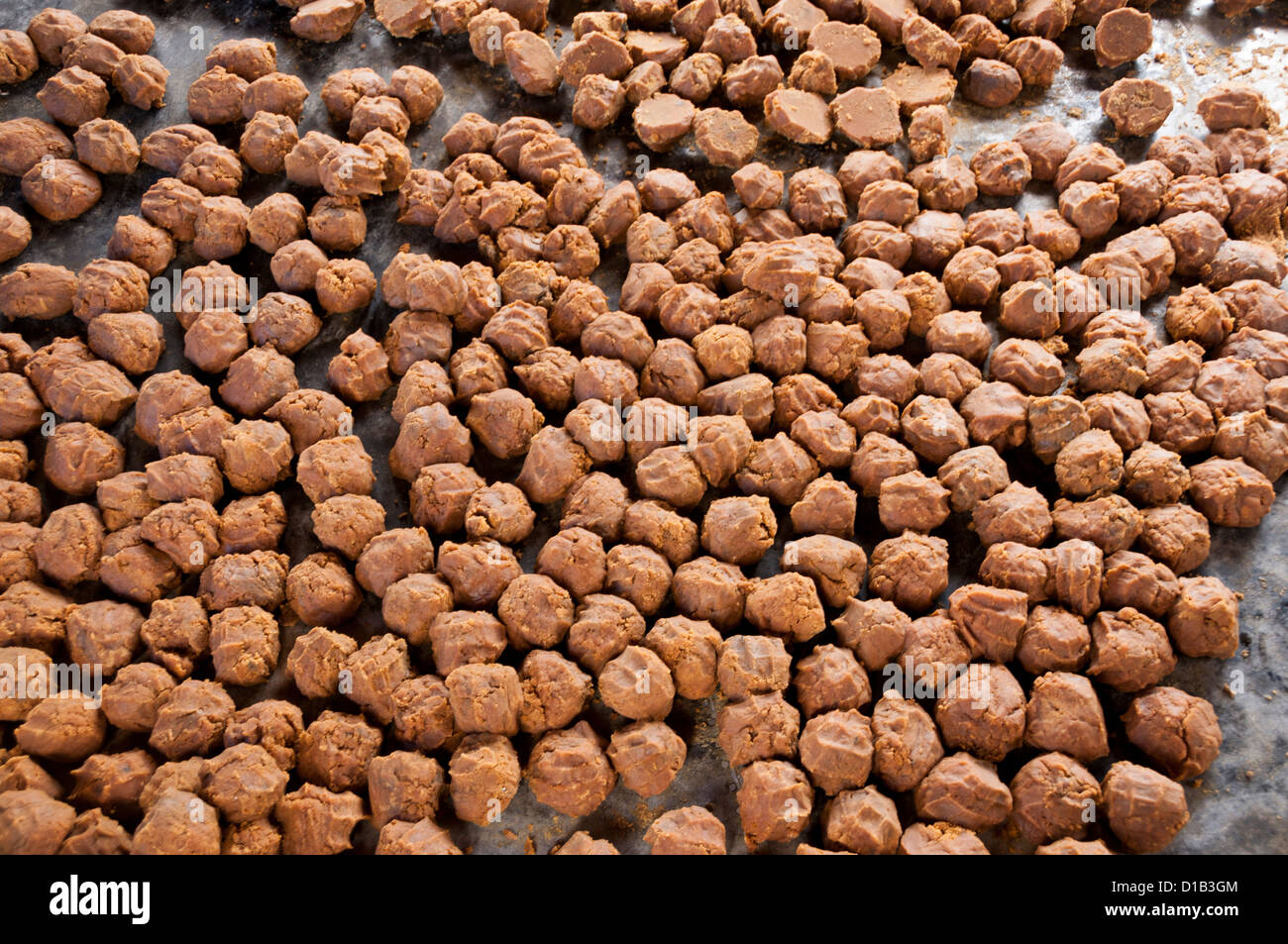 Jaggery balls produced from sugar cane juice Stock Photo