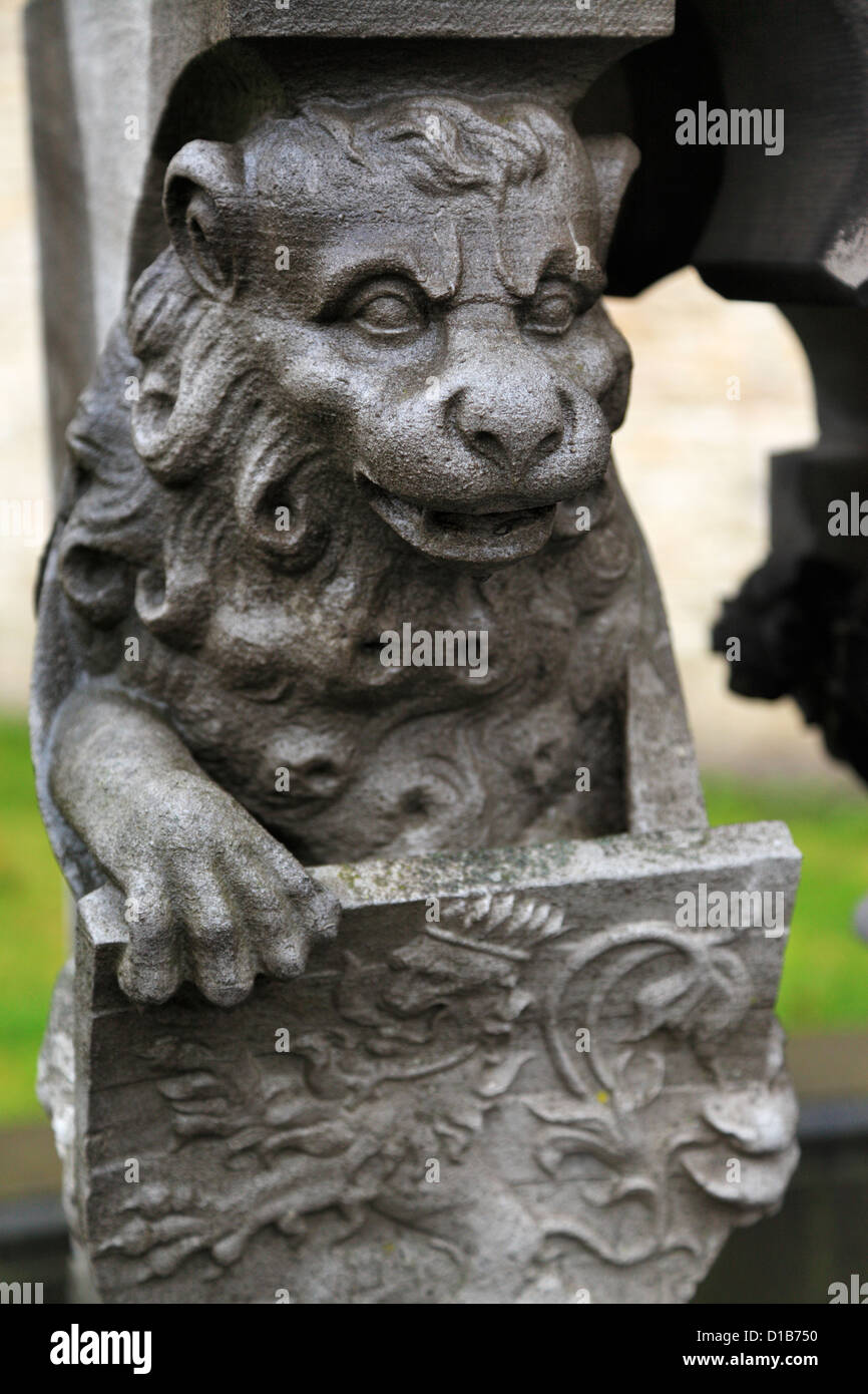 Detail of a lion holding a shield from a statue in Bruges, Belgium Stock Photo