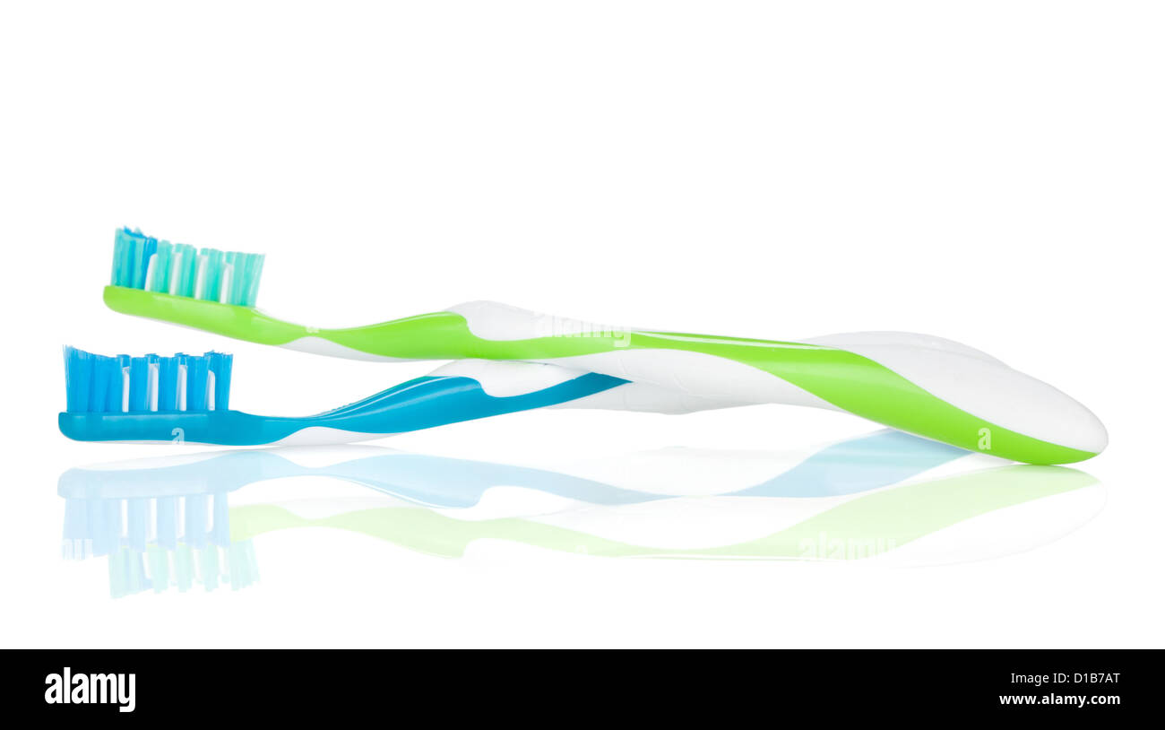 Two colorful toothbrushes. Isolated on white background Stock Photo - Alamy