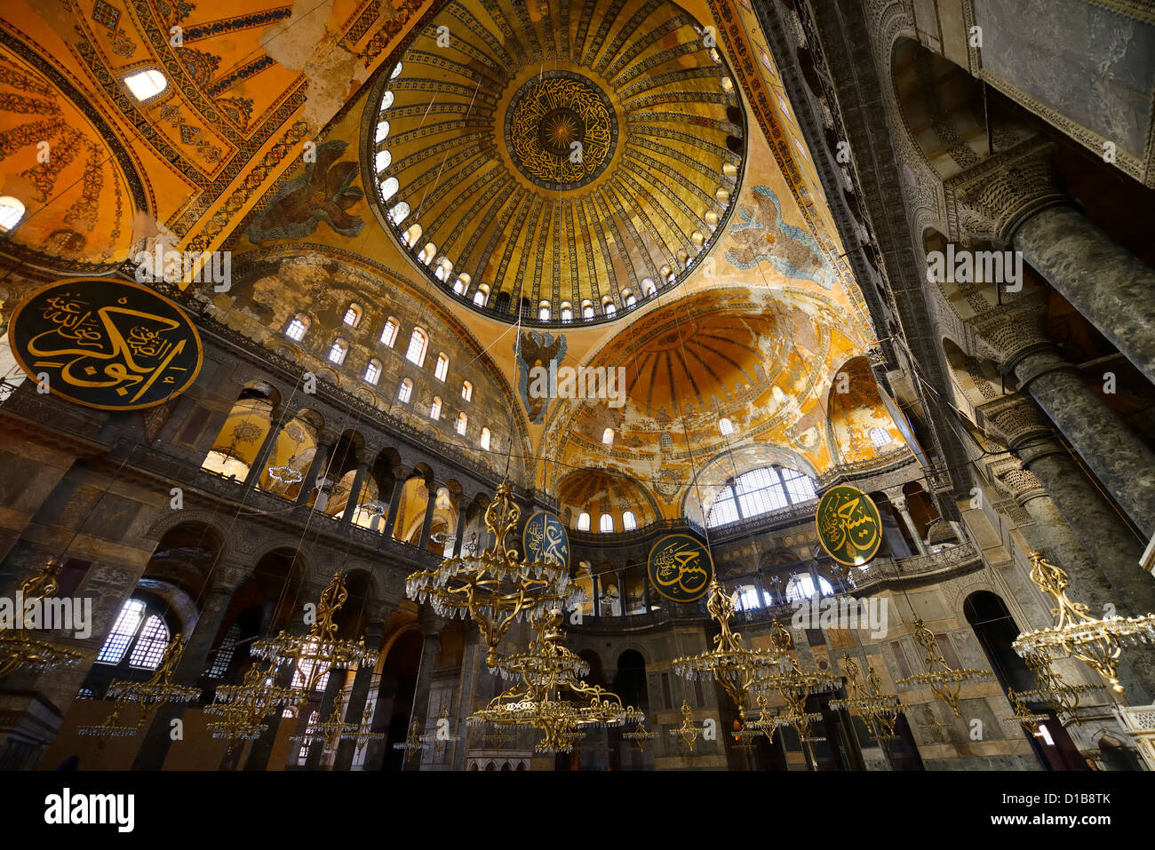 Golden domes frescoes and six winged Saraphim in the Hagia Sophia with chandeliers Istanbul Turkey Stock Photo