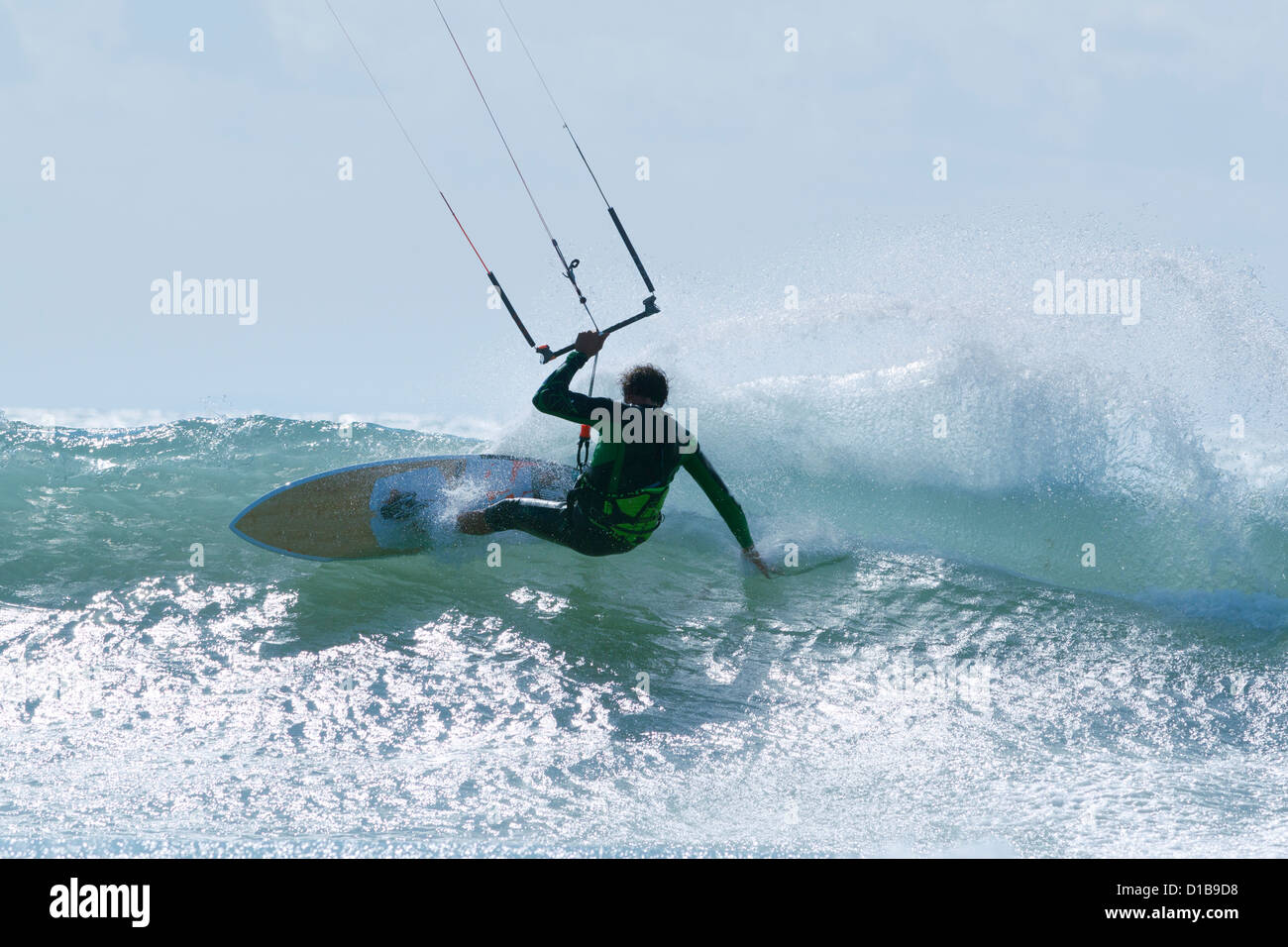 Kitesurfer slashing a wave. Tarifa, Costa de la Luz, Cadiz, Andalusia, Spain. Stock Photo
