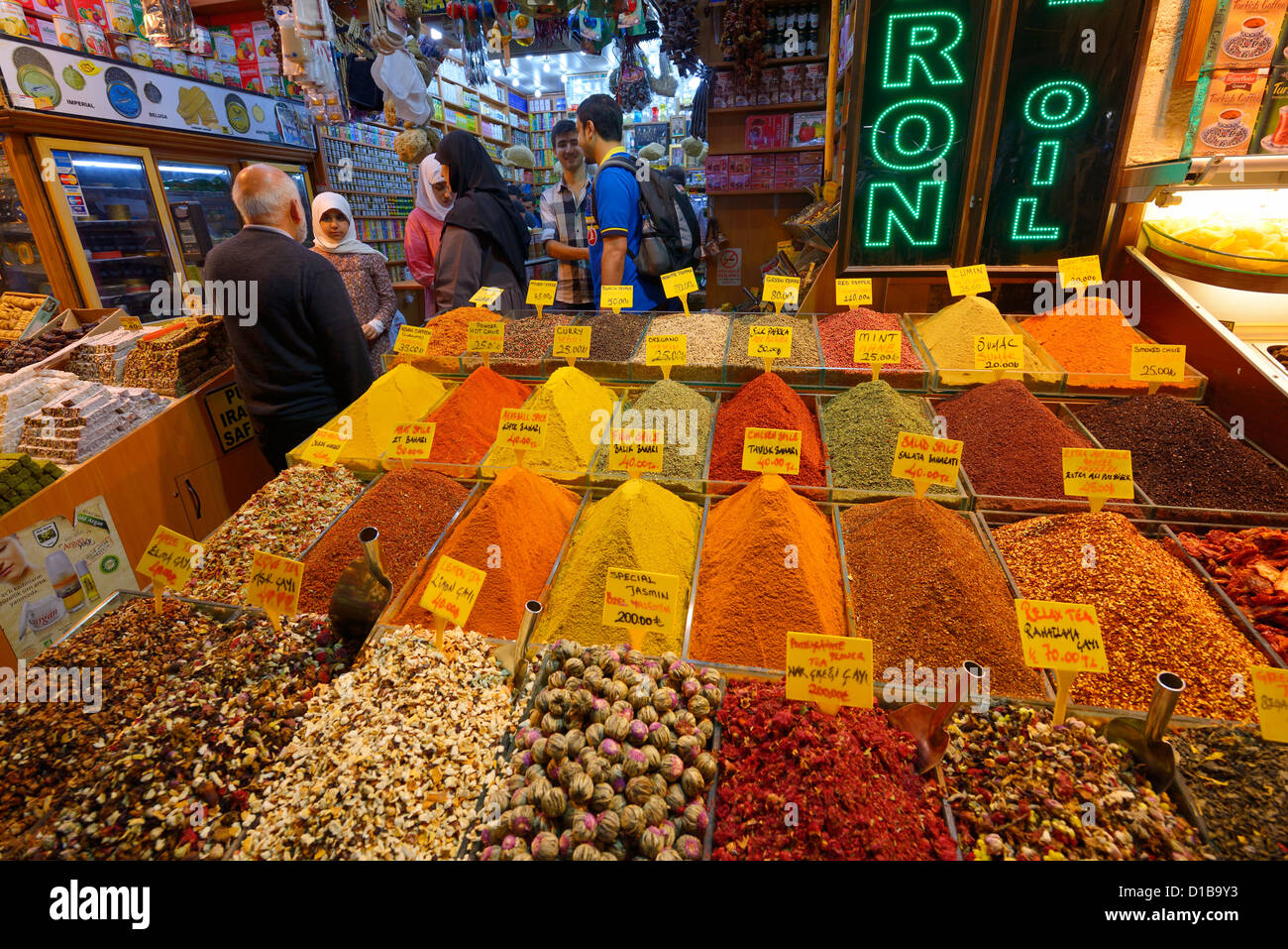 Local Turkish family shopping at a store in the Egyptian Spice Bazaar Eminonu Fatih Istanbul Turkey Stock Photo
