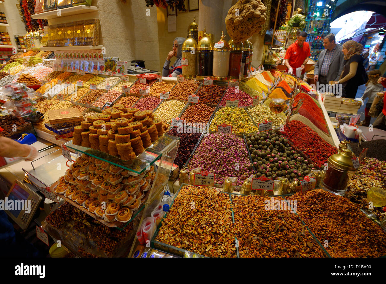Turkish family shopping for dryed fruit in the Egyptian Spice Bazaar Eminonu Fatih Istanbul Turkey Stock Photo