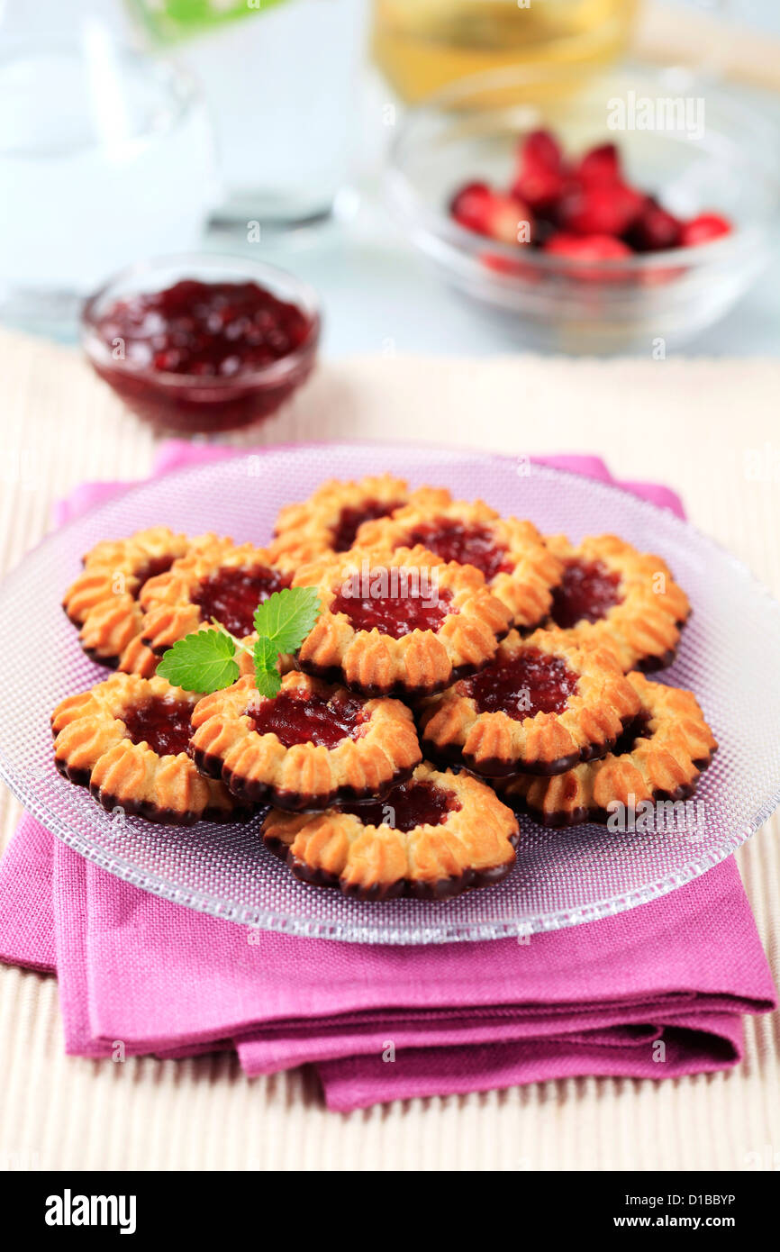 Chocolate dipped butter cookies with jam centers Stock Photo Alamy