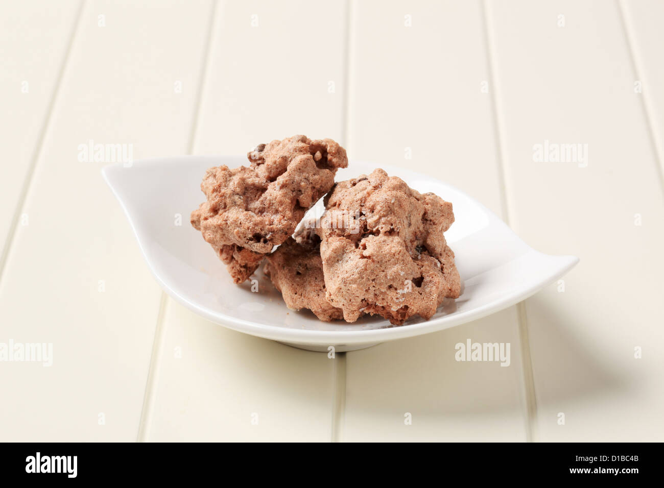Chocolate meringue cookies with chopped nuts inside Stock Photo Alamy