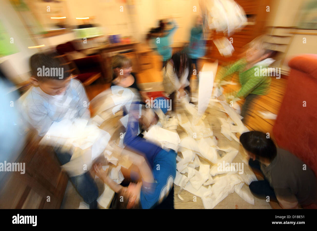 Berlin, Germany, kids throwing paper in the air Stock Photo
