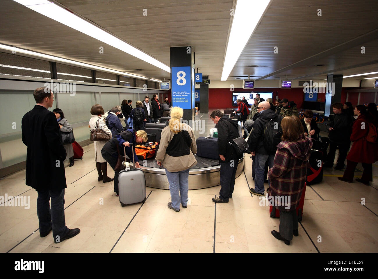Paris, France, travelers waiting for their luggage at the terminal of the airport, Orly Stock