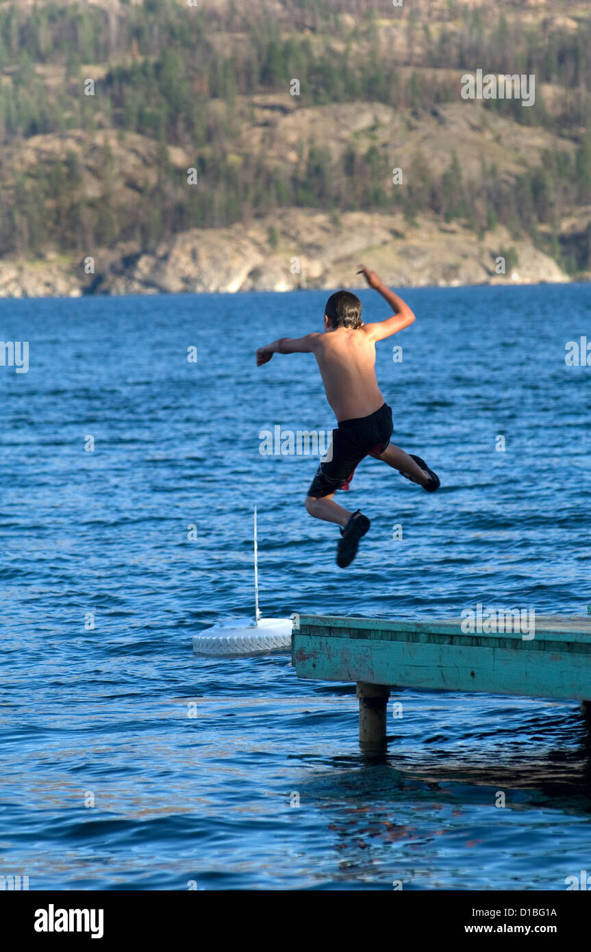 Boy jumping off pier hires stock photography and images Alamy