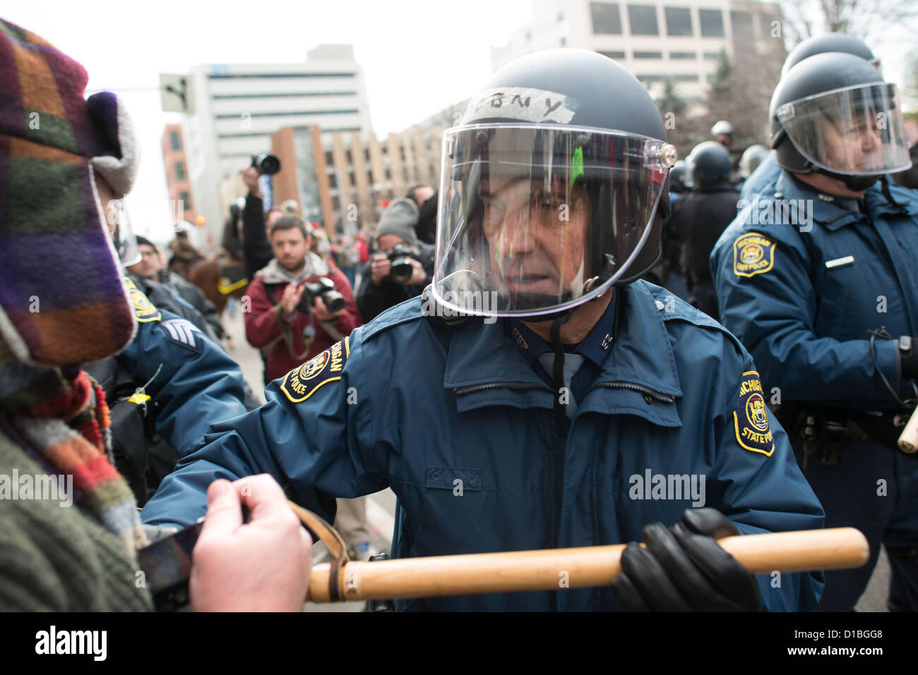 Dec. 11, 2012 - Lansing, Michigan, USA - Michigan State Police violently clash with pro-union protesters out side the Gov. George Romney state building in Lansing Tuesday afternoon. (Credit Image: © Courtney Sacco/ZUMAPRESS.com) Stock Photo