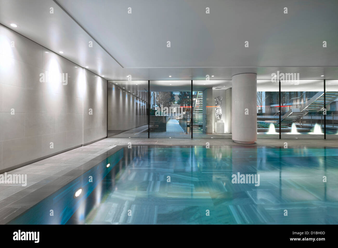 Kinesis Spa, London, United Kingdom. Architect: Squire + Partners , 2012. Detailed view through from swimming pool to central ga Stock Photo