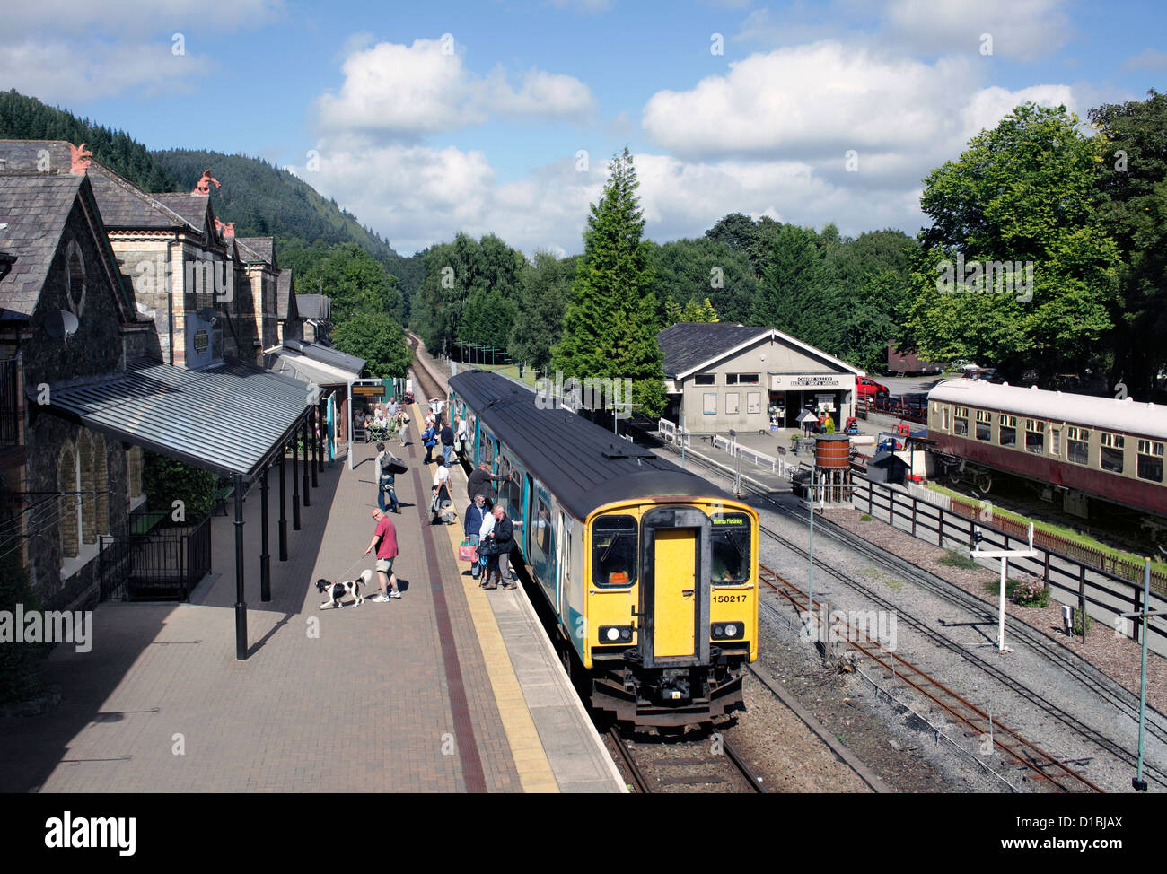 Passengers getting off a Llandudno to Blaenau Ffestiniog train at Betws-y-Coed, Gwynedd. Stock Photo