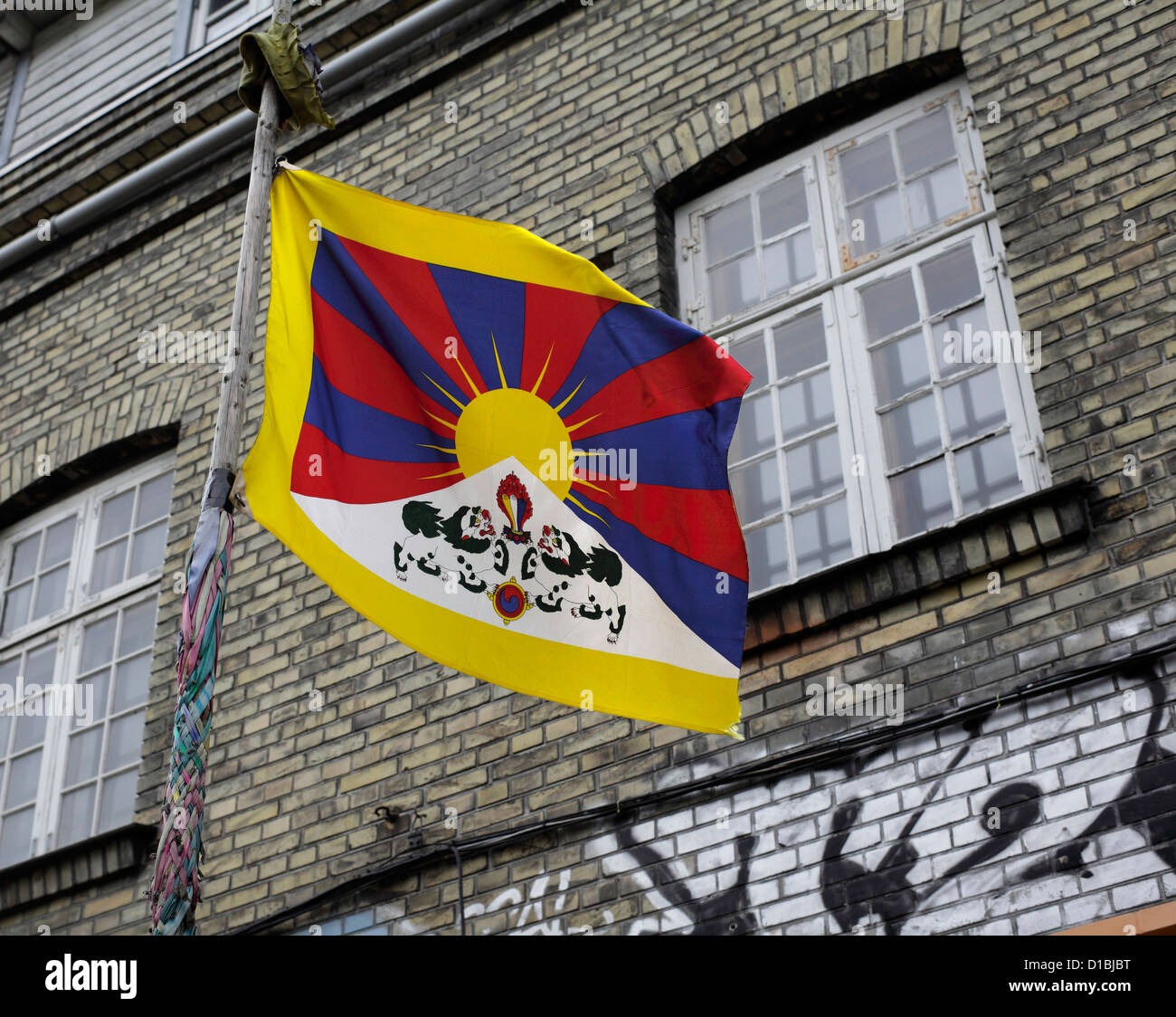 A 'Free Tibet' flag flying outside a building in Christiania, Copenhagen, Denmark. Stock Photo
