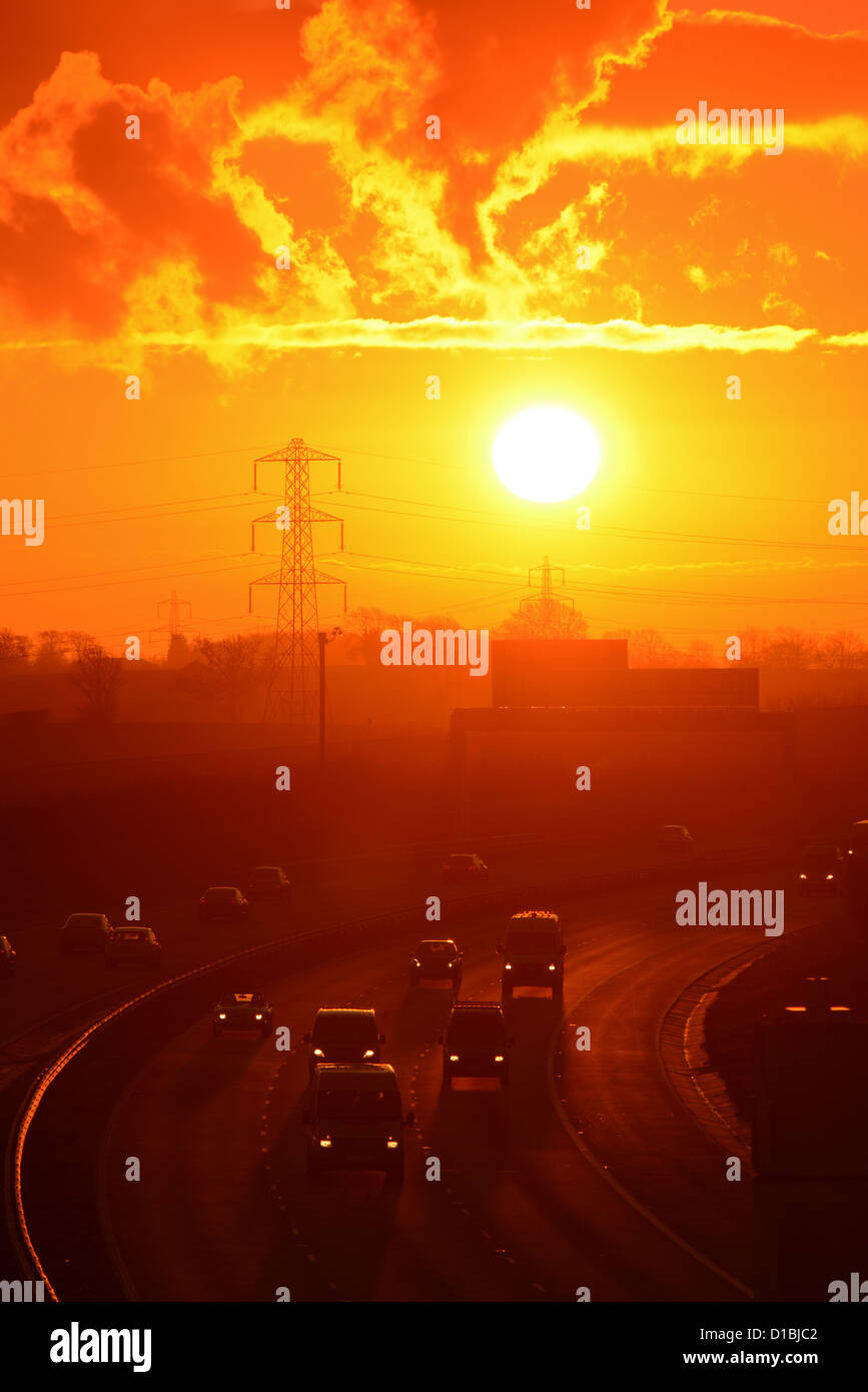 traffic travelling on the A1/M motorway at sunrise leeds uk Stock Photo