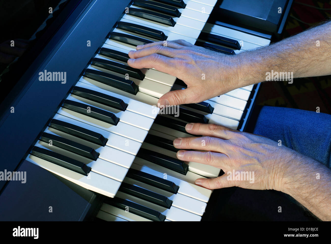 Playing a two manual electric keyboard Stock Photo Alamy