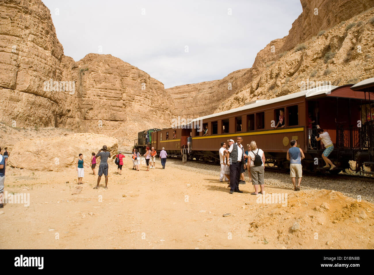 View of the Red Lizard train stopped in the Seldja Gorge from Metlaoui in  Tunisia Stock Photo - Alamy