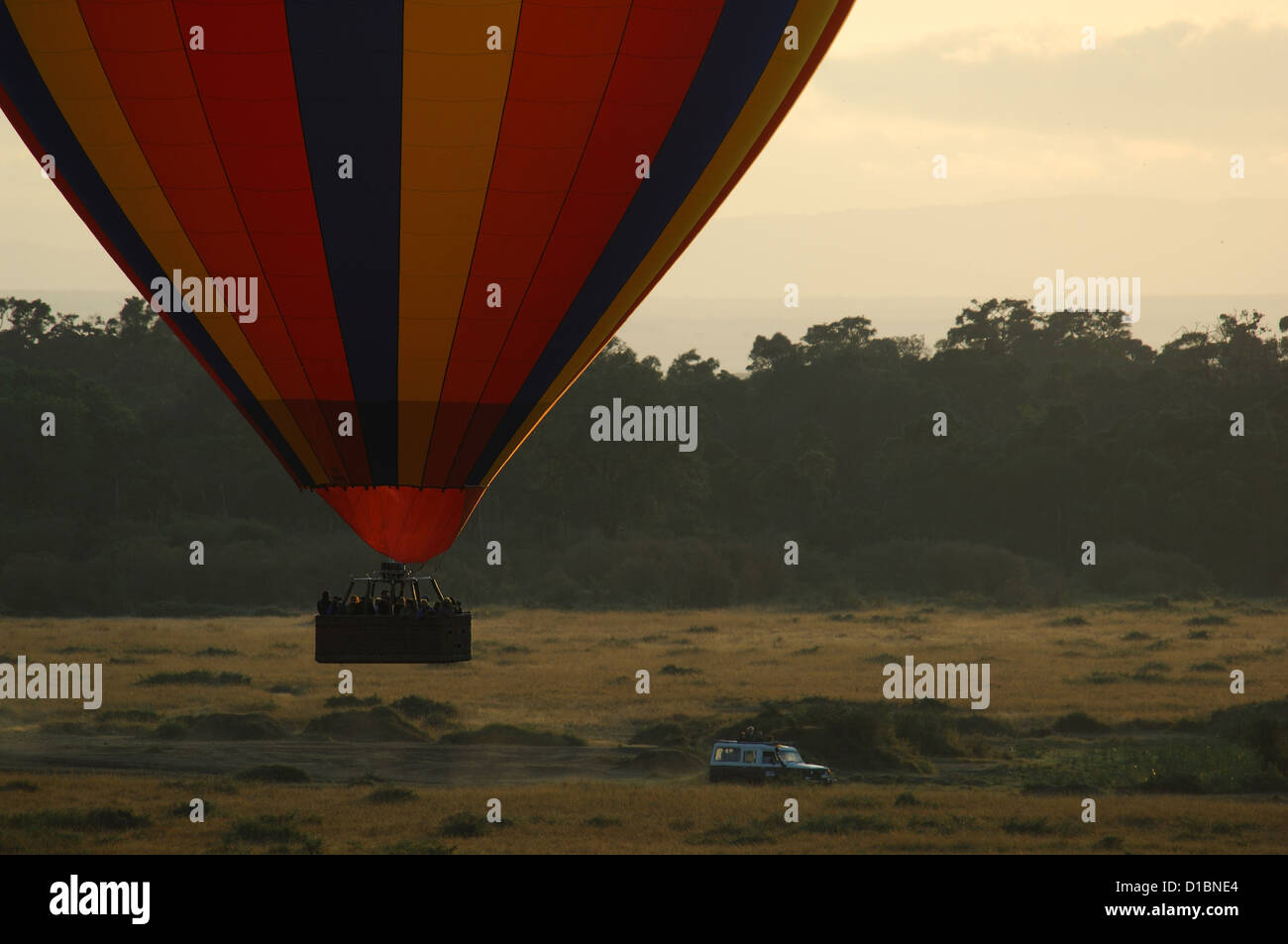 Tourists fly over the Mara River in a hot air balloon, Masai Mara Reserve Kenya Africa Stock Photo