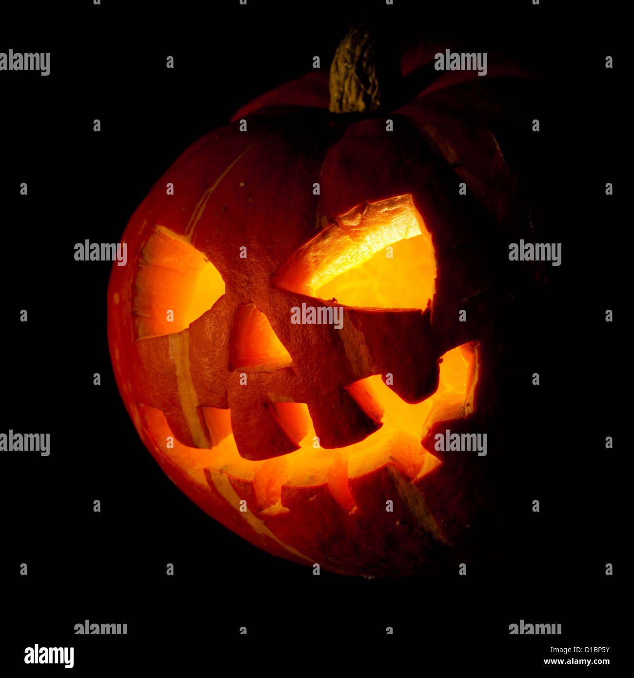 Scary old jack-o-lantern on black background Stock Photo - Alamy