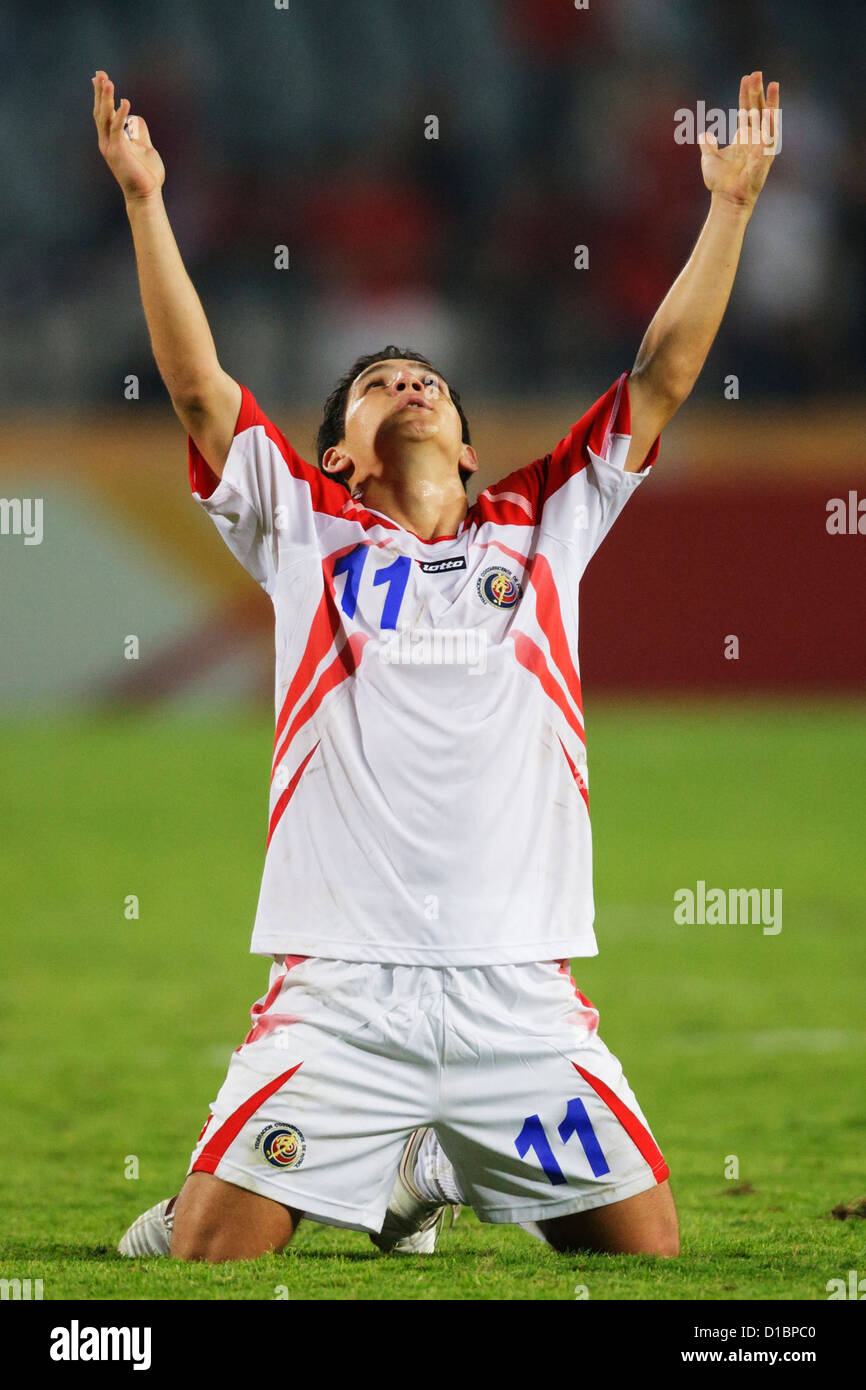Diego Madrigal of Costa Rica raises his arms after Costa Rica defeated Egypt in the 2009 FIFA U-20 World Cup round of 16 match. Stock Photo