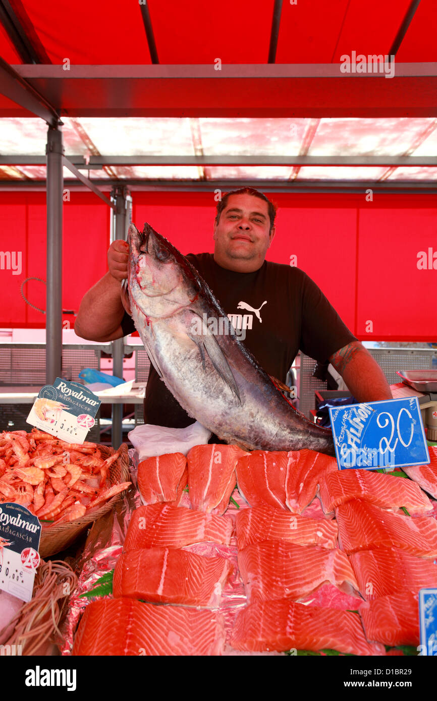 Fisherman in the popular market of La Liberation in Nice city Stock Photo