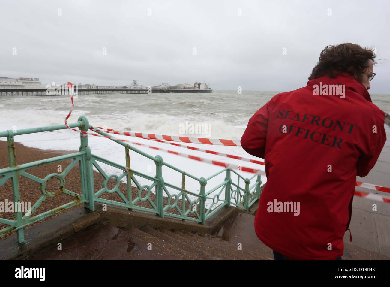 Sea Front Officers close parts of the beach as high winds and seas threaten flooding.in Brighton. Stock Photo