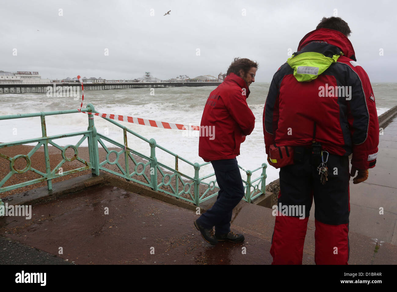 Sea Front Officers close parts of the beach as high winds and seas threaten flooding.in Brighton. Stock Photo