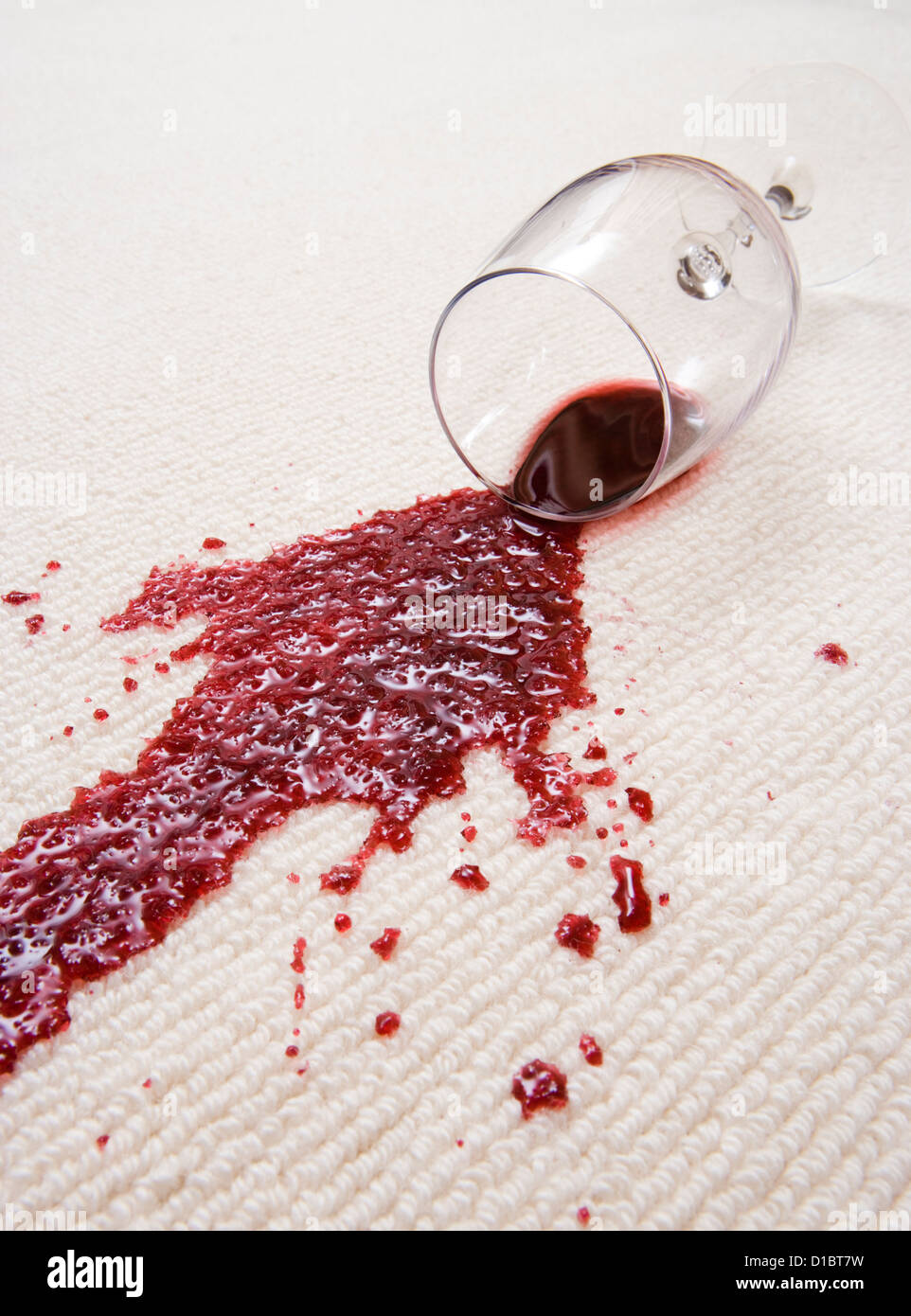 Red wine spilled on carpet. Stock Photo