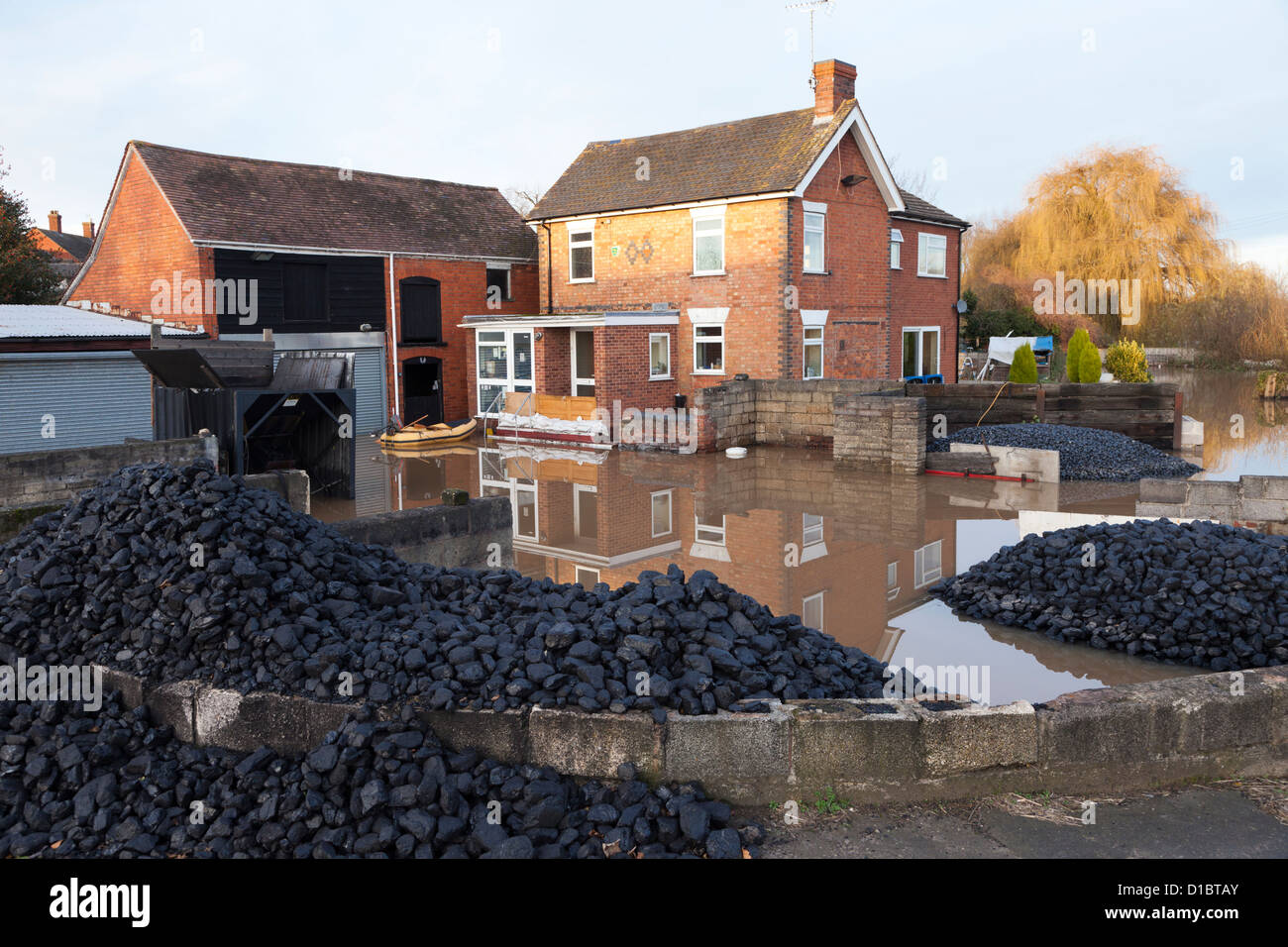 Floods by the River Severn - 29th November 2012 - local coal yard by the River Severn flooded at Maisemore, Gloucestershire, UK Stock Photo