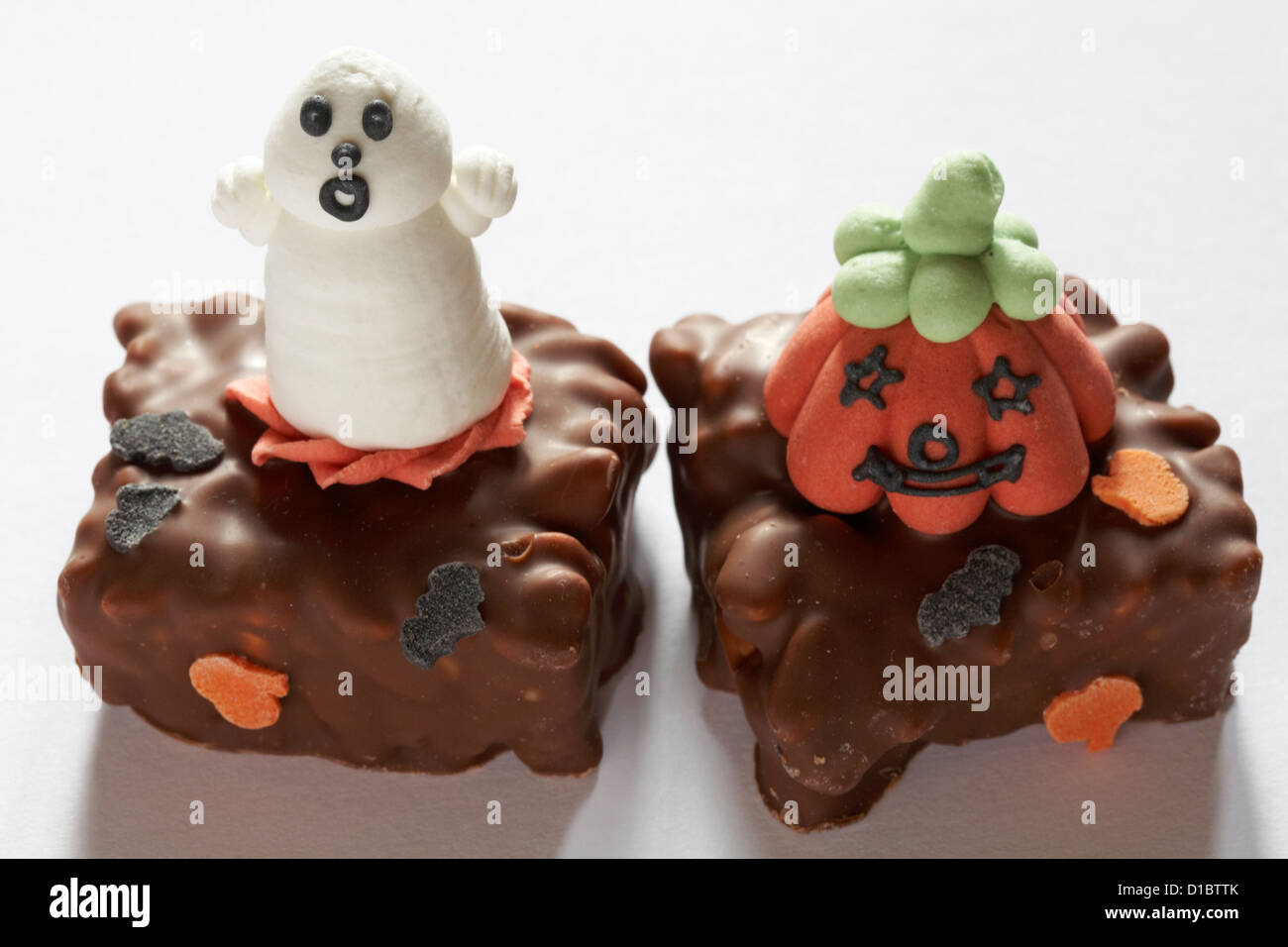 Halloween pumpkin and ghost cake biscuits isolated on white background