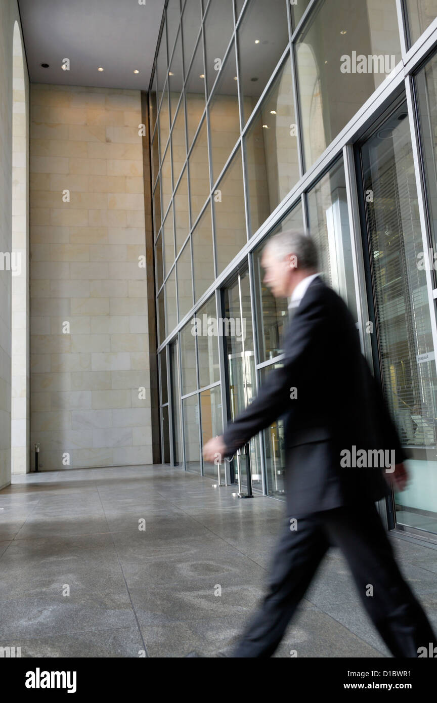 Berlin, Germany, a man in a suit is leaving the Reichstag Stock Photo