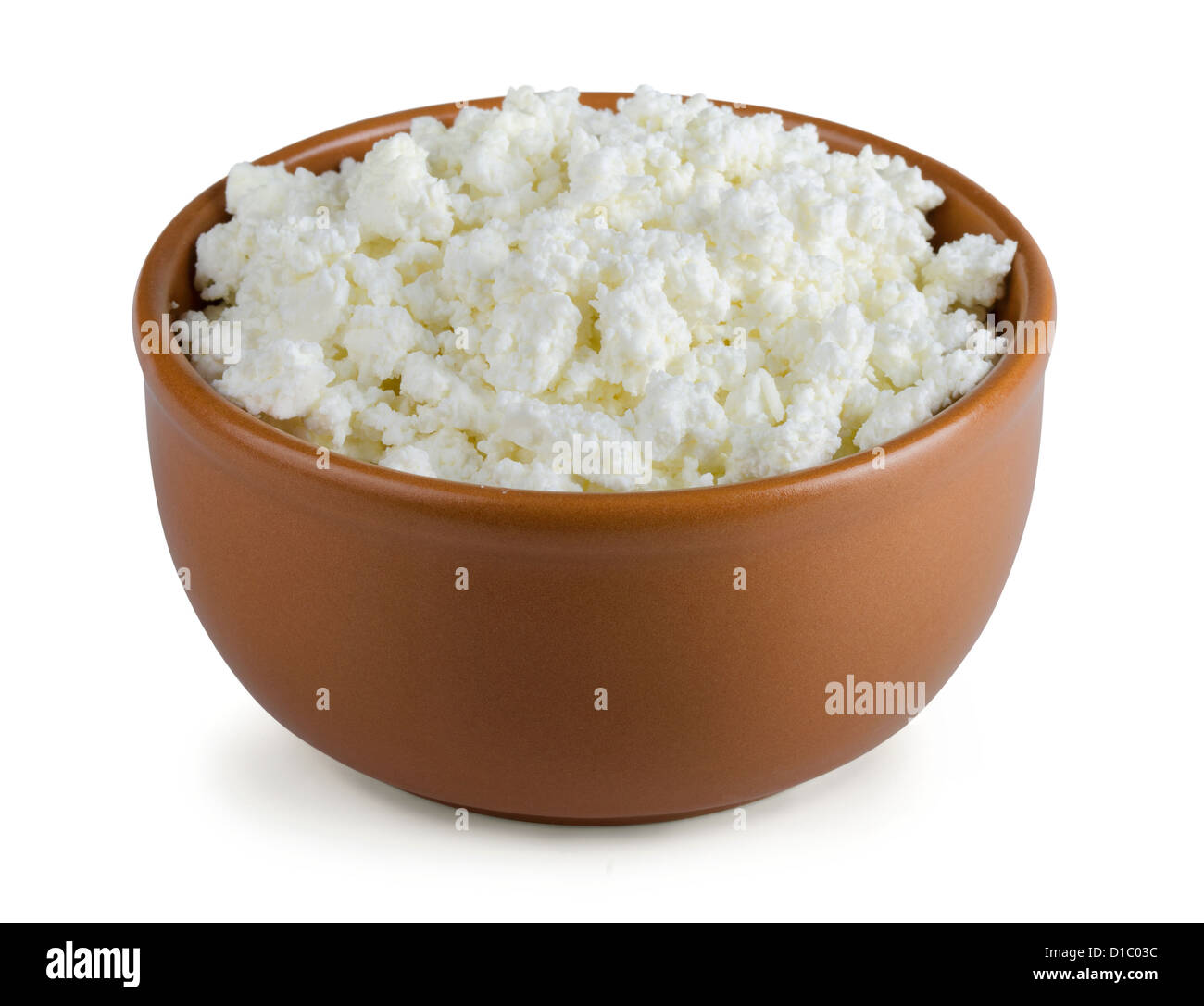 Brown clay bowl of cottage cheese isolated on white Stock Photo