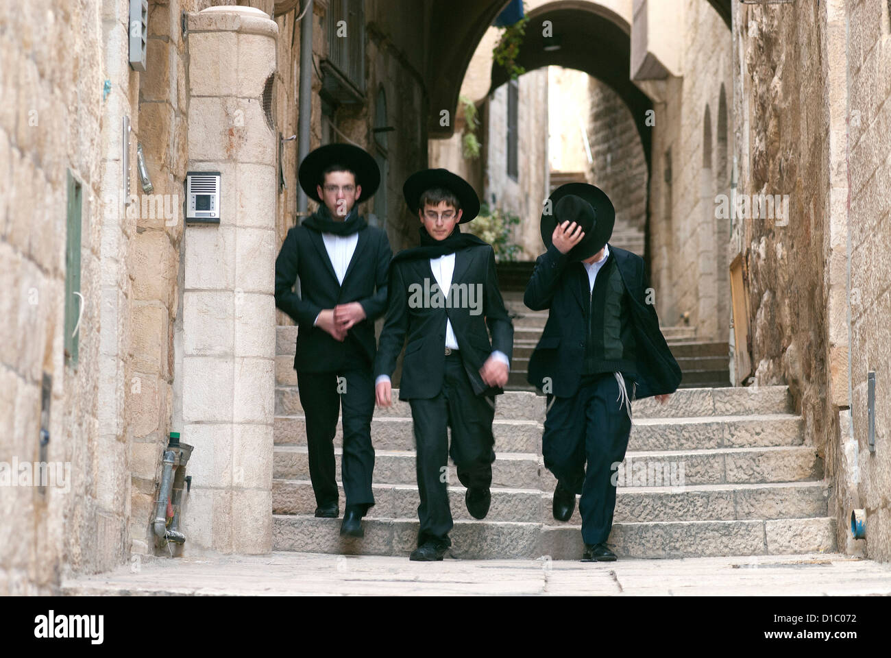 Israel, Jerusalem. Three boys walking in the Jewish Quarter of Jerusalem. Stock Photo