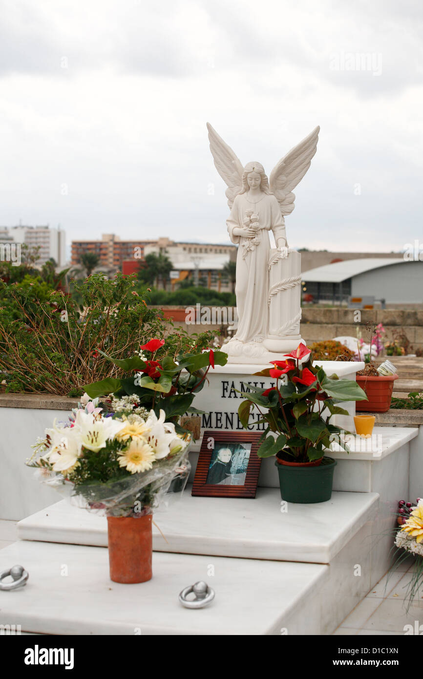 Alcudia, Mallorca, Spain, angel sculpture on a grave in the town cemetery Stock Photo