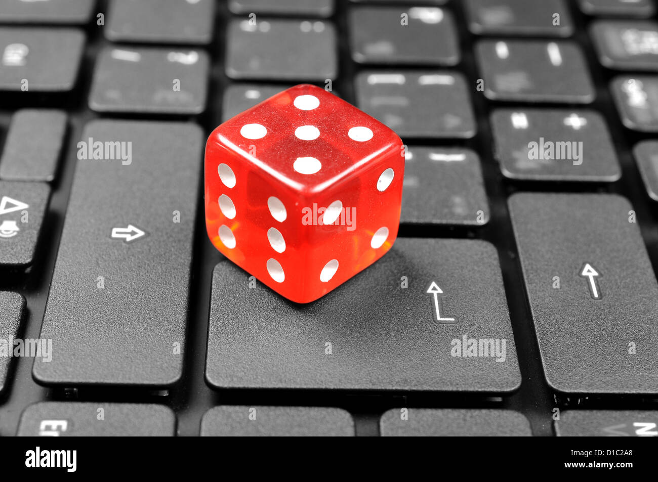Dice on keyboard Stock Photo Alamy