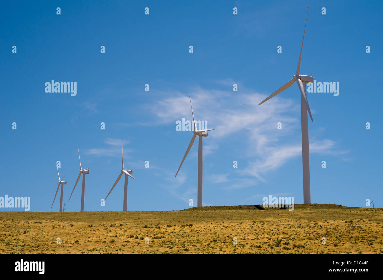 Wind turbines against blue sky and clouds Stock Photo - Alamy