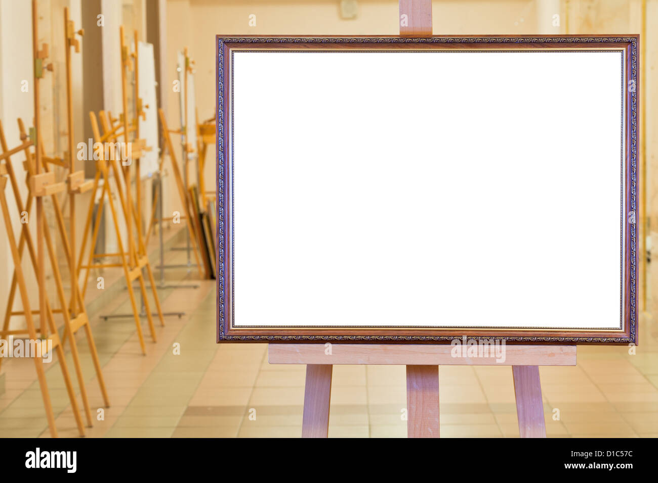 big picture frame with white cut out canvas on easel in gallery hall Stock Photo