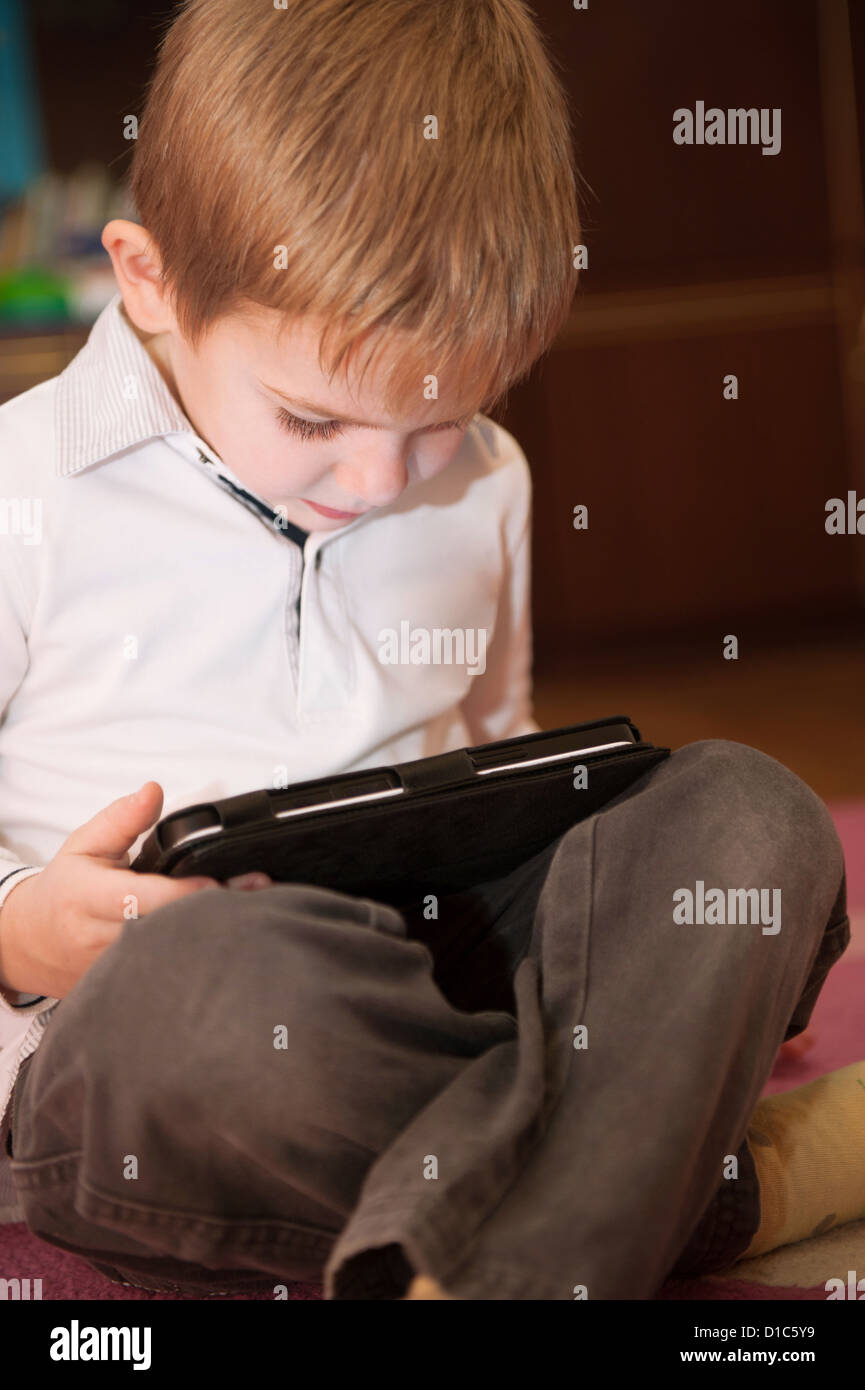 Cute little boy study with digital tablet computer Stock Photo - Alamy