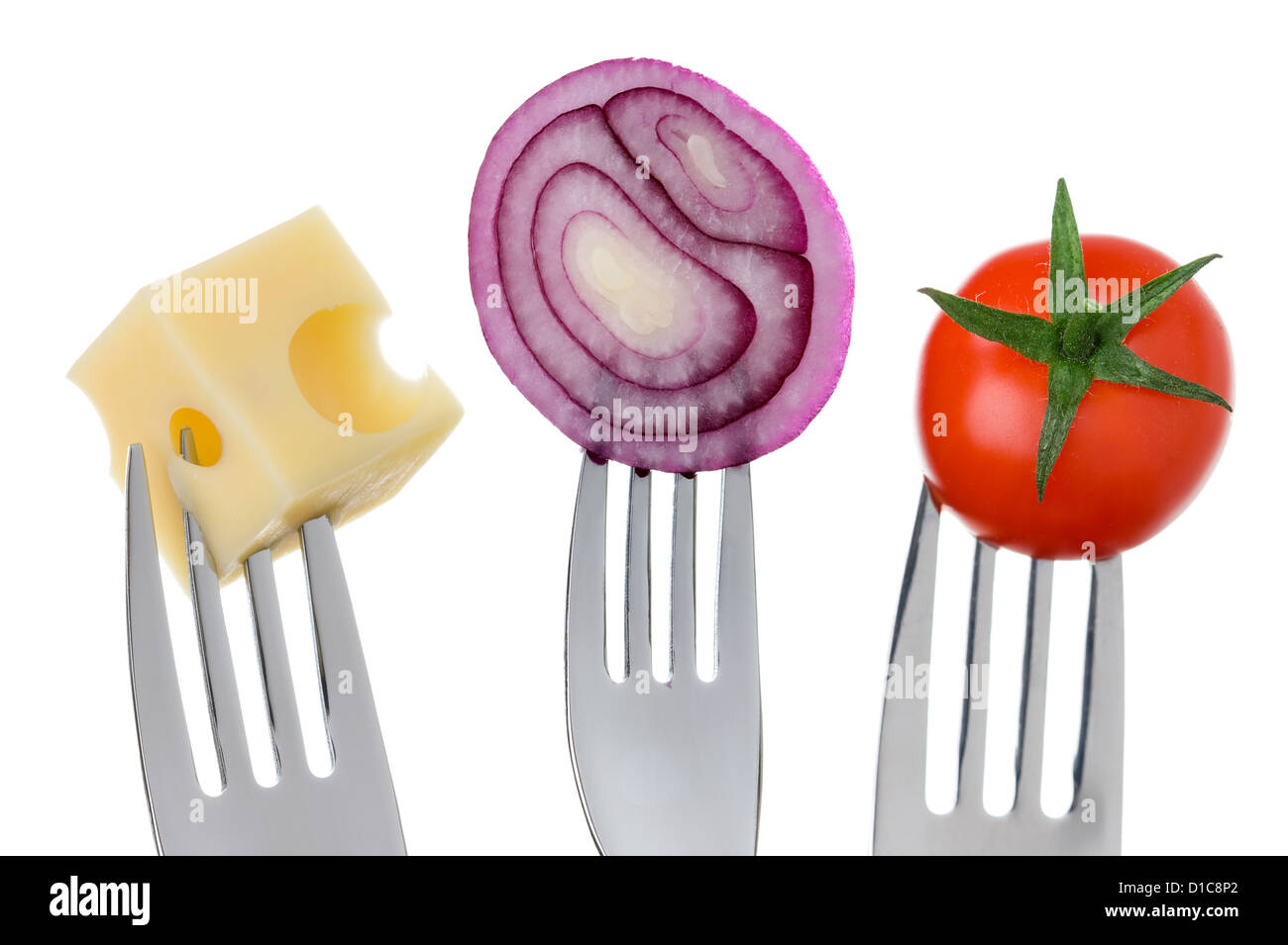 emmental cheese onion and tomato on forks against white background Stock Photo