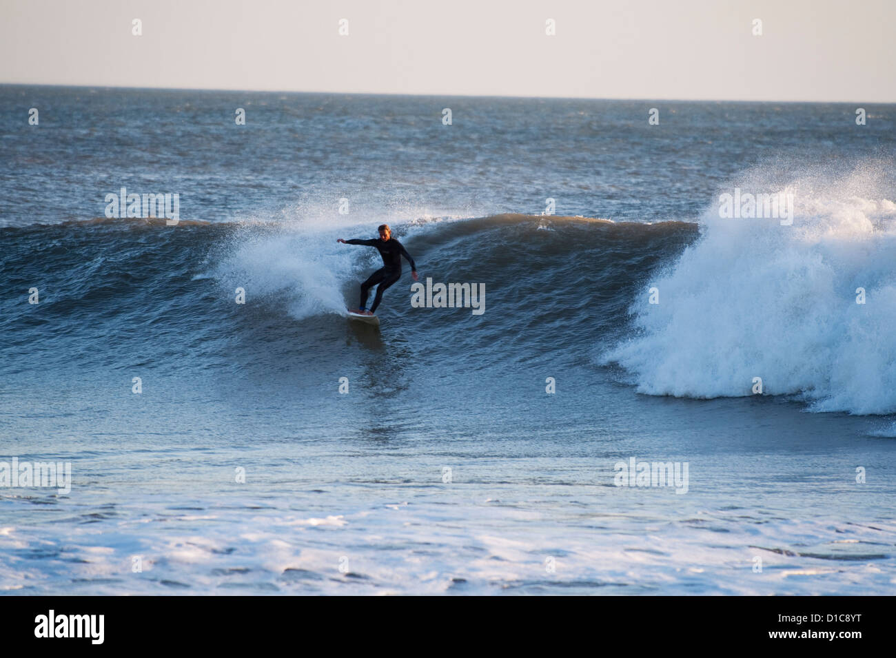 Man surfing at Anchor Point, Taghazout, Morocco Stock Photo