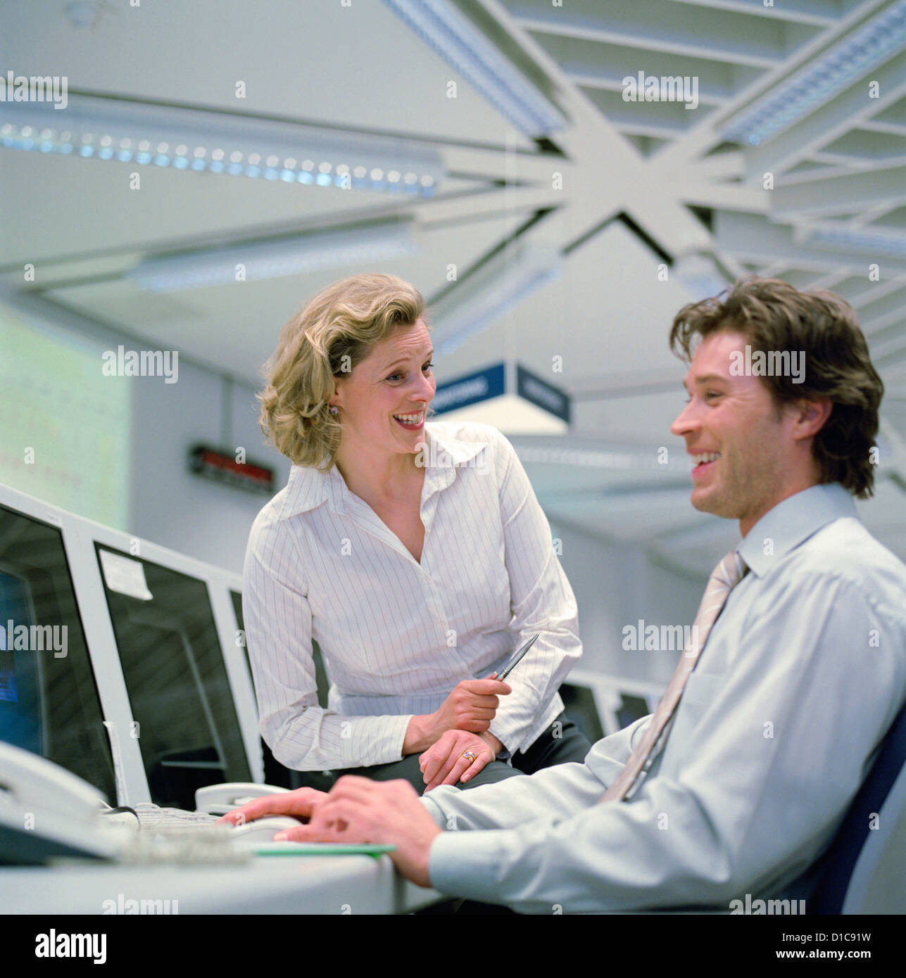 Business people data center control center man woman License free except ads and billboards Stock Photo